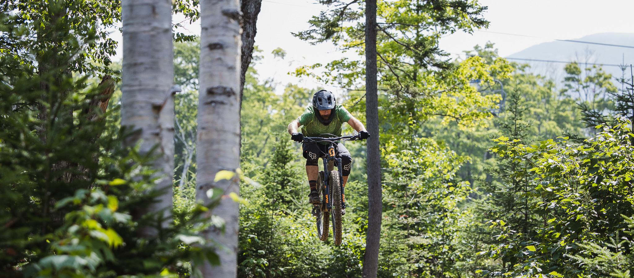 mountain bike rider hitting a jump