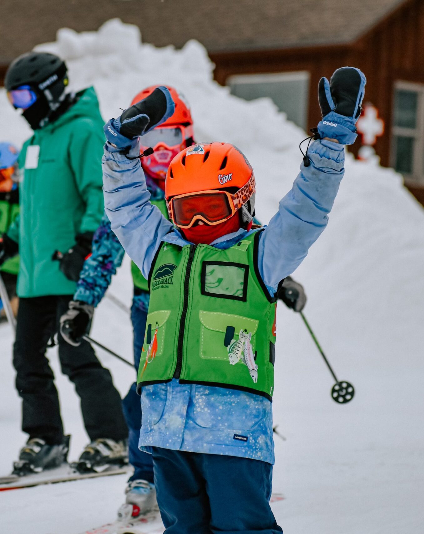 Ski Tuesday kid hands in the air